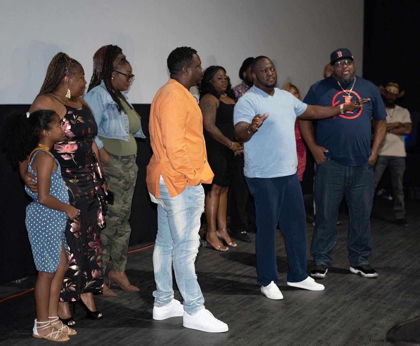 Guests gather in front of the screen at the Forbidden Daughter premiere